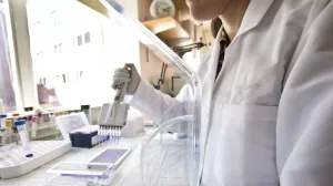 Closeup of researcher working in lab of the Clinical and Translational Research Center.